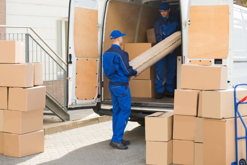 Student removals team handling boxes in West Ham