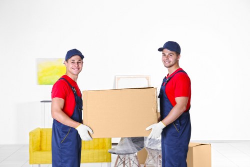 Removal staff loading household items during a Westham move