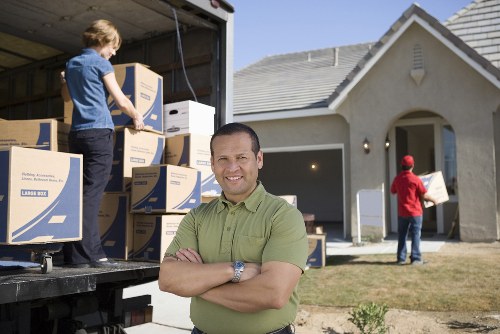 Professional movers handling apartment furniture in Westham