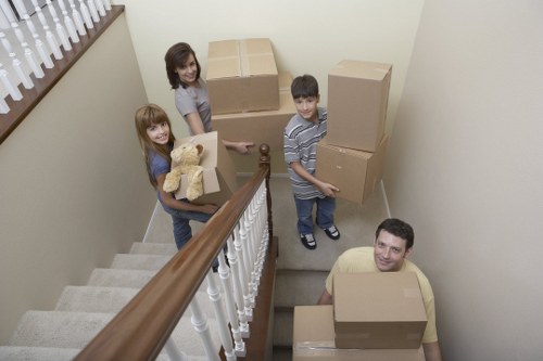 Packed moving boxes and furniture ready for house removals
